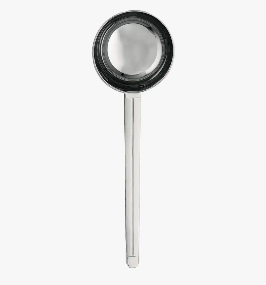 Solid steel ladle from the Guéthary collection by Puiforcat on a light background.