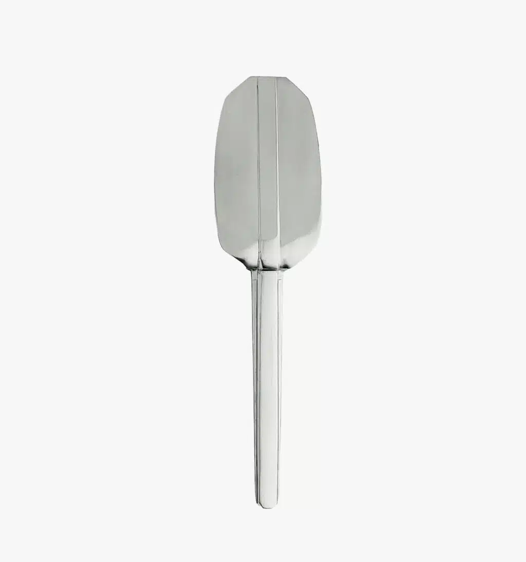 Stainless steel tart server from the Guéthary collection by Puiforcat on a light background.