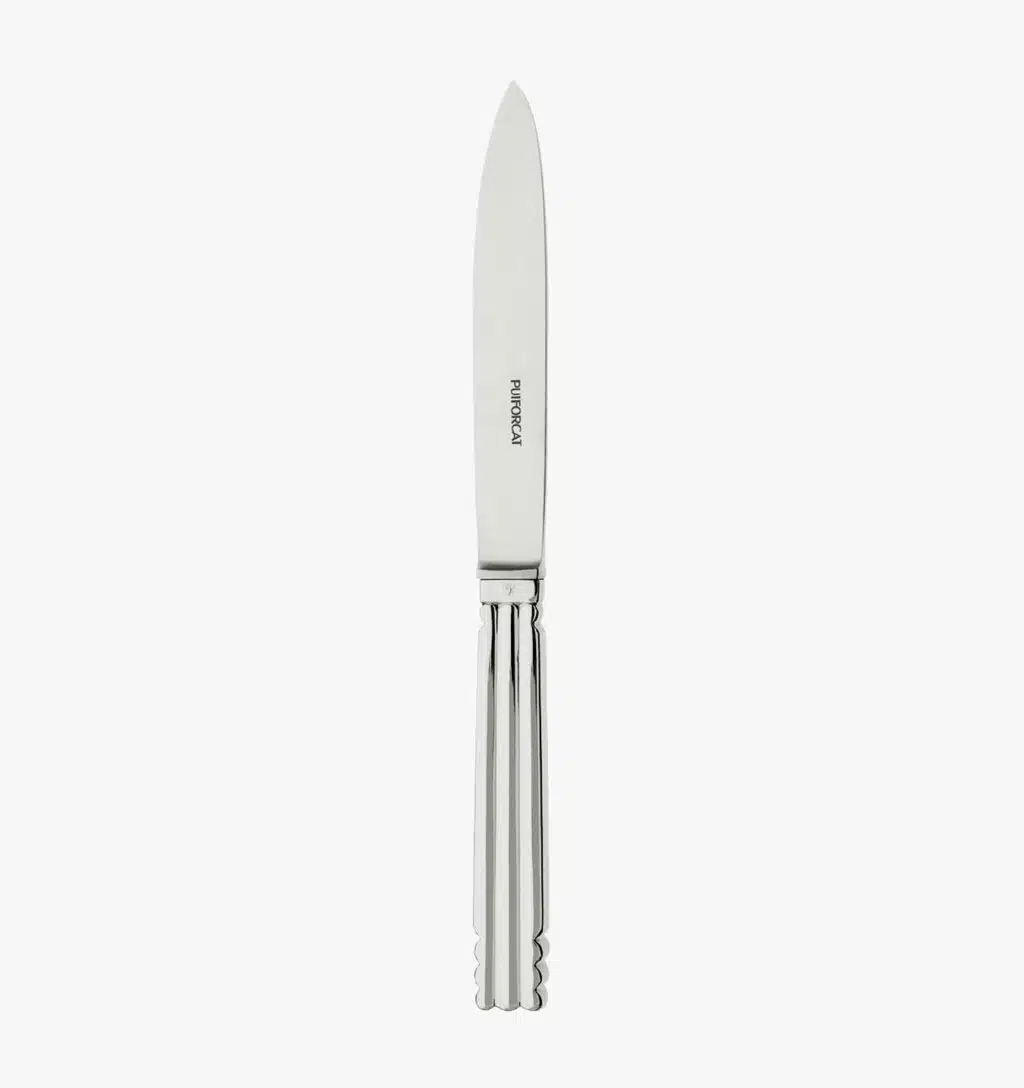 Dessert knife in silver plated from the Nantes collection by Puiforcat on a light background.