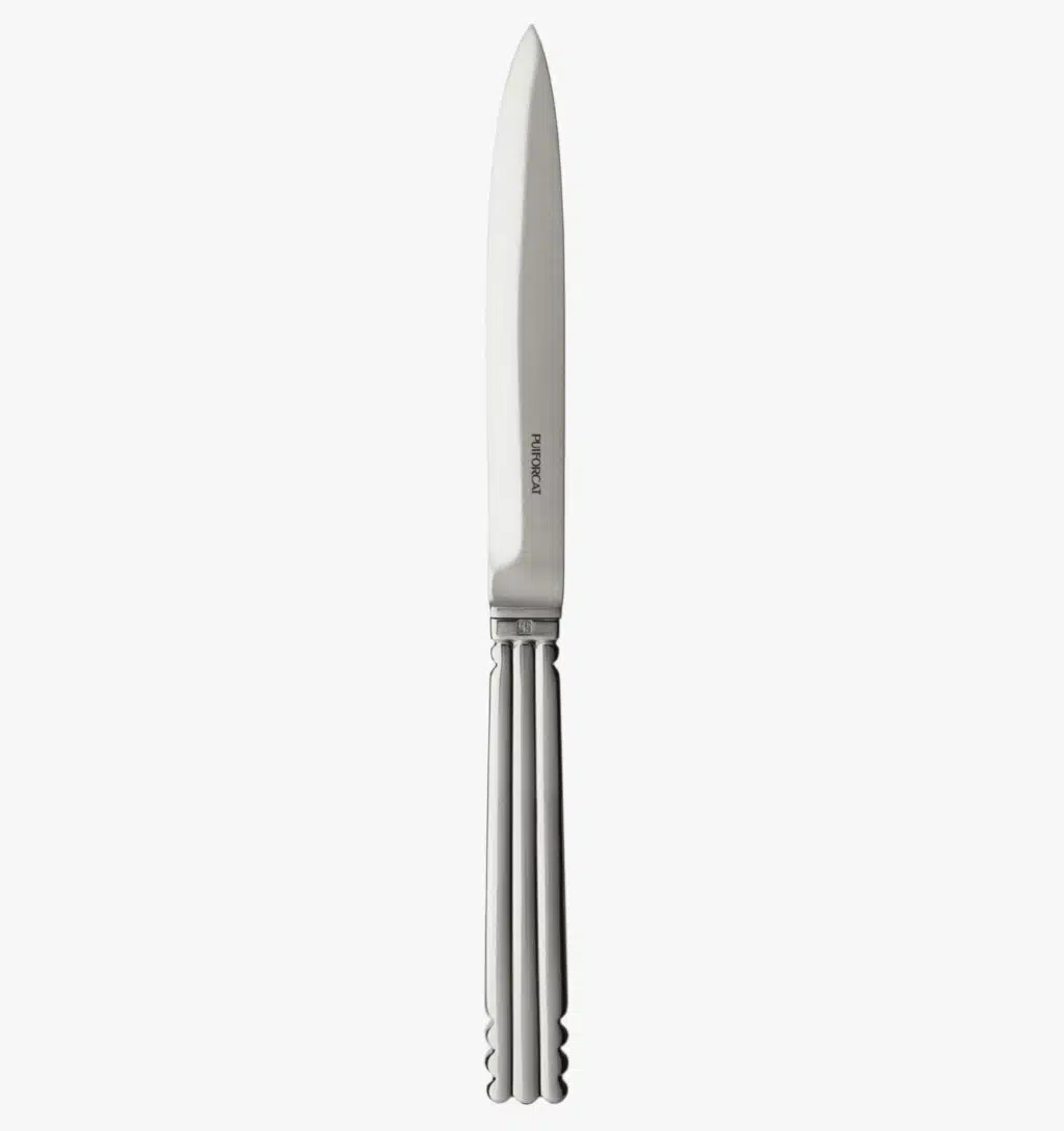 Table knife in silver plated from the Nantes collection by Puiforcat on a light background.