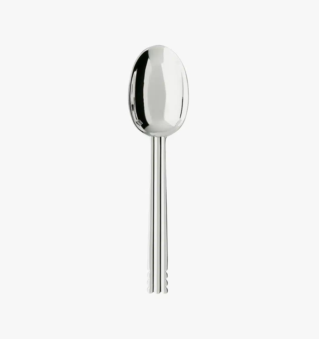 Silver plated tea spoon from the Nantes collection by Puiforcat on a light background.