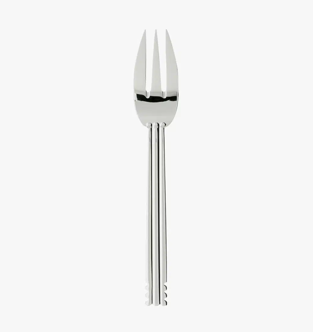 Silver plated salad fork from the Nantes collection by Puiforcat on a light background.